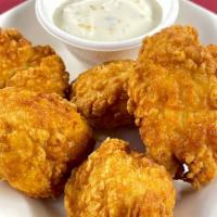 Chicken Nuggets · With your choice of seasoning and dipping sauce.