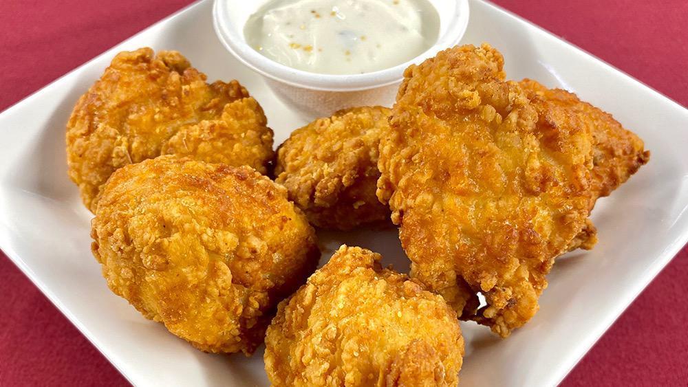 Chicken Nuggets · With your choice of seasoning and dipping sauce.