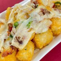 Loaded Tater Tots · Loaded with cheese, green onions, and bacon