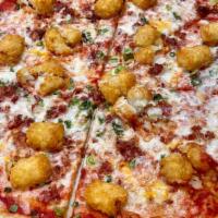 Loaded Tots Pizza · Tomato basil sauce, cheddar provolone mix, green onions, bacon, and tater tots!