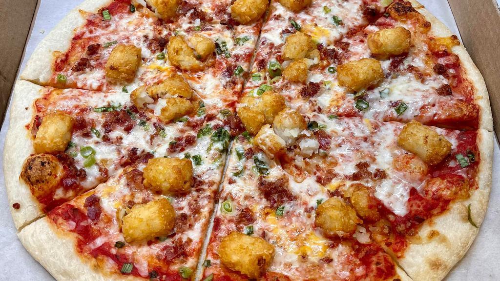 Loaded Tots Pizza · Tomato basil sauce, cheddar provolone mix, green onions, bacon, and tater tots!