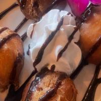 Deep Fried Oreos · 4 battered deep fried Oreos w/ whipped cream and chocolate drizzle