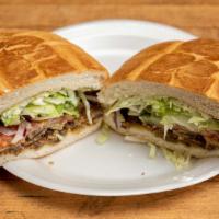 Milanesa · Breaded steak, tomatoes, red onions, jalapeños, lettuce, Swiss cheese, avocado and mayonnaise.