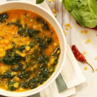 Saag Daal · Fresh spinach cooked with yellow lentils.