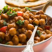 Chana Masala · Garbanzo beans cooked with herbs and spices.
