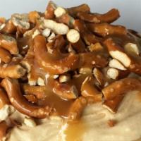 Salted Caramel Cheesecake Roll · To make our Salted Caramel Cheesecake Roll we top cream cheese frosting with salted pretzel ...
