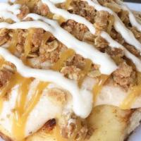 Caramel Pumpkin Cheesecake Roll · This fall-inspired roll is made with pumpkin spice frosting, pie crumble, caramel sauce, and...