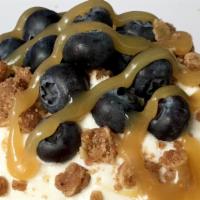 Caramel Blueberry Pie Roll · This roll is topped with vanilla frosting, fresh blueberries, house-made pie crumble, and sw...