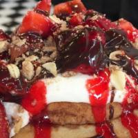 Chocolate Strawberry Cheesecake Roll · This roll is made with cream cheese frosting, house-made pie crumble, fresh strawberries, st...