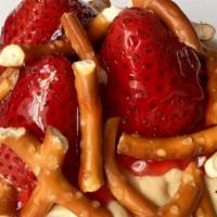 Salted PB&J Roll · This roll has peanut butter frosting topped with fresh strawberries, salted pretzels, and a ...
