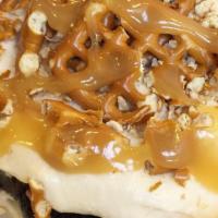 Salted Caramel Brownie · We top a fresh, warm brownie with creamy vanilla frosting, salted pretzels, and sweet carame...