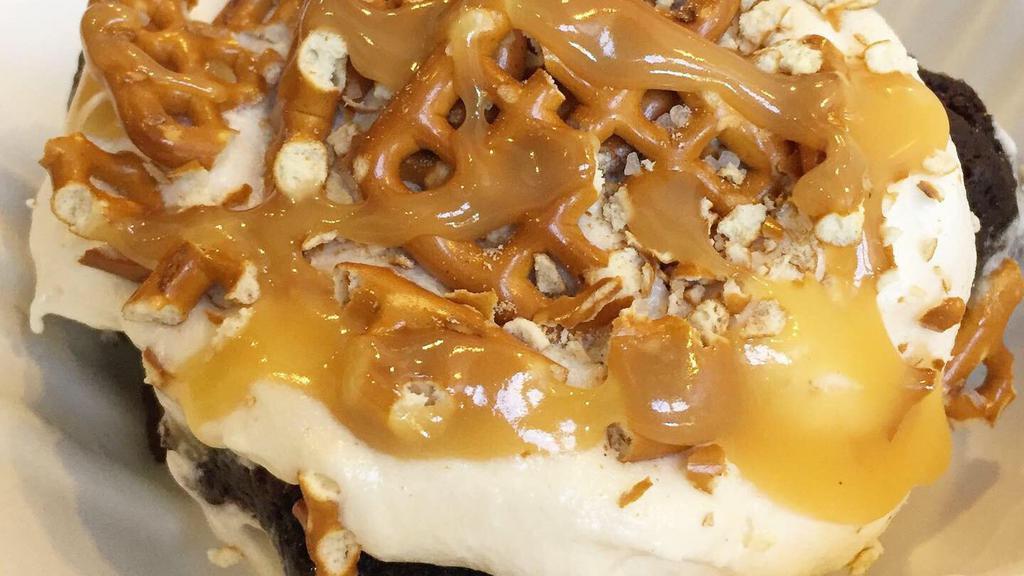 Salted Caramel Brownie · We top a fresh, warm brownie with creamy vanilla frosting, salted pretzels, and sweet caramel sauce.