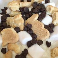 S'more Brownie · A warm brownie is topped with marshmallow frosting, mini marshmallows, chocolate chips, and ...