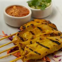 Satay Chicken  · Sala Thai's Favorite. Grilled marinated  chicken on skewers with Thai herbs, spices, and coc...