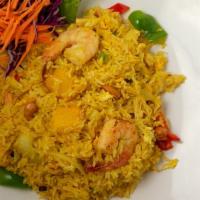 Pineapple Fried Rice · Fried Rice with Chicken and prawns, onion, bell pepper, raisin, cashew nut, and pineapple wi...