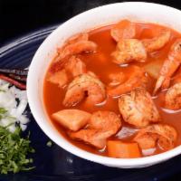 Caldo de Camaron · Large prawn soup with vegetables and tortillas or tostadas.