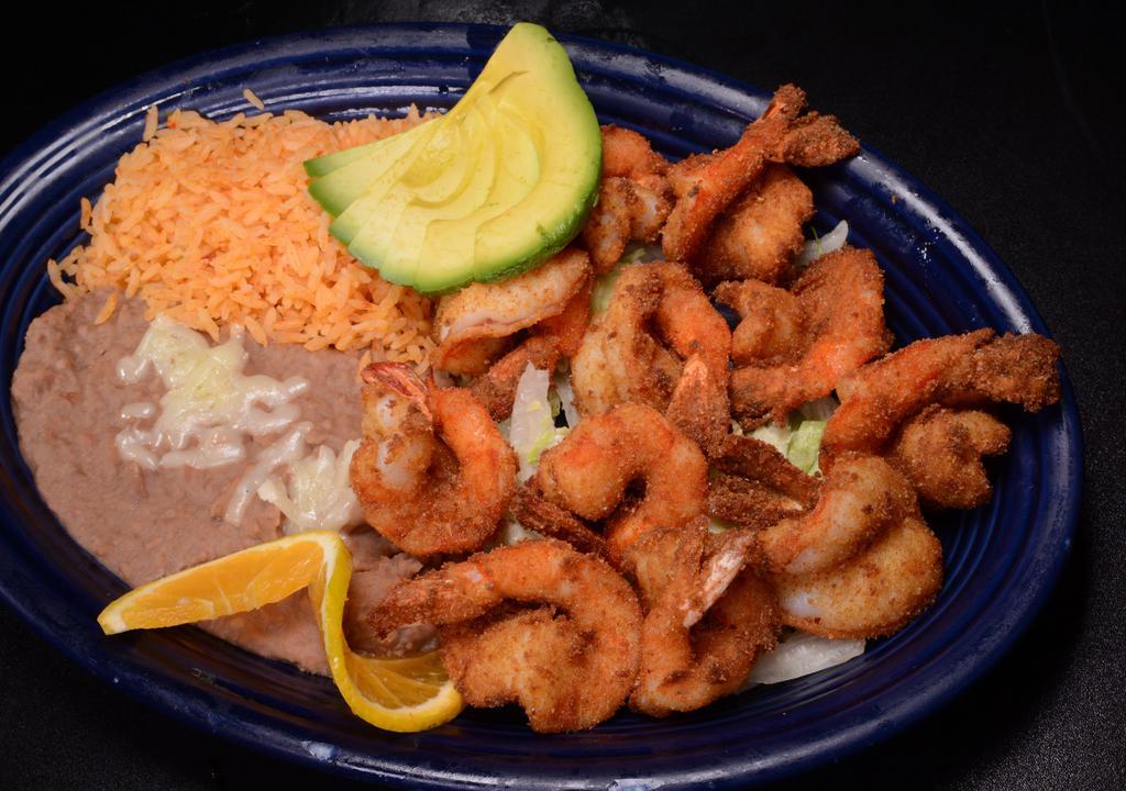 Camarones Empanizados · Bread crumbled large prawn with beans, rice, and served on a bed of lettuce.