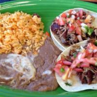 Taco Plate · One soft taco with refried beans & rice.