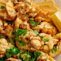 Coliflor Frito · Flash fried cauliflower mixed with spicy cashew cheese