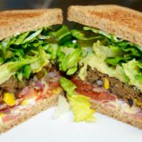 14. Black Bean Veggie Patty Sandwich (warm) · Organic Black Bean patty, avocado, lettuce, tomato, onion, pickle, mayo, mustard, extra virg...