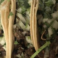 Regular Taco · Your Choice of Meat with cilantro and onions.