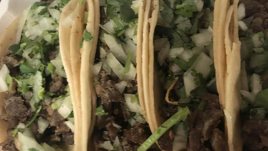 Regular Taco · Your Choice of Meat with cilantro and onions.