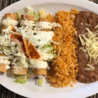 Flautas Platillo · 3 chicken flautas topped with lettuce, sour cream, onions, cheese and salsa. Served with Ric...