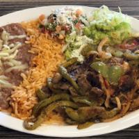 Fajitas · Steak, Chicken or Pork sautéed with onions and bell peppers with rice and beans.