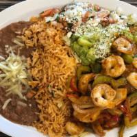 Shrimp Fajitas · Shrimp sautéed with onions and bell peppers with rice and beans.