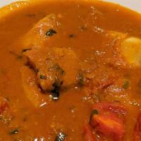Fish Curry · Fish stakes marinated in special spices & cooked with onion, tomato & garam masala