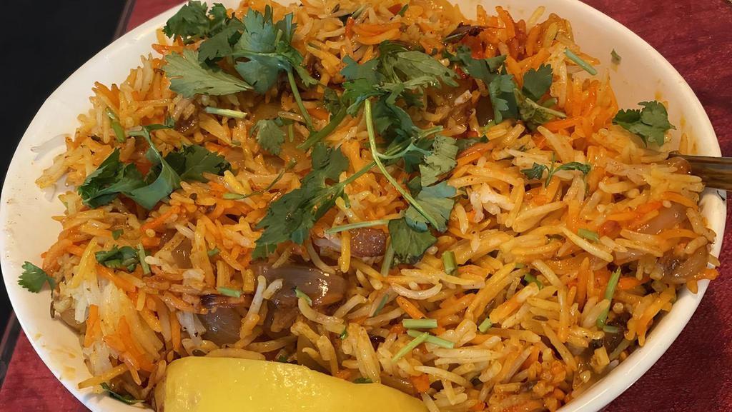 Prawn Biryani · Fine basmati rice fried and cooked with large prawns, saffron & fragrant spices