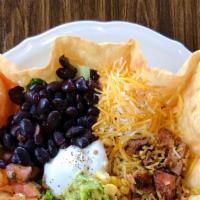 Taco Salad · Grilled Chicken, Rice, Black Beans, Corn over Romaine Lettuce and topped with Guacamole, Sou...