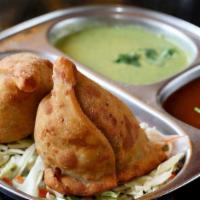Samosa · Spiced potato in a crust of fried dough.
