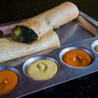 Spinach Masala Dosa · Thin rice crepe smeared with spinach and stuffed with spiced potatoes. Served with sambar an...