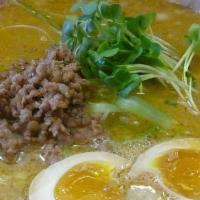 Curry Ramen · Curry soy sauce broth with chashu pork, ground pork, egg, bamboo, kaiware sprouts, naruto fi...