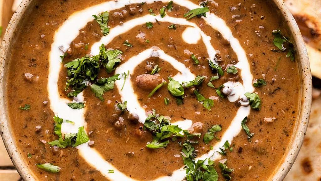 72. Dal Makhani (Lentils) · Creamed black lentils in a mixture of spices. Served with Rice