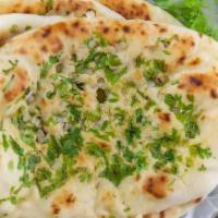 23. Garlic Naan · Naan smeared with fresh garlic.