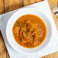 45. Chicken Curry · Boneless chicken cooked in mildly spiced gravy. Served with Rice