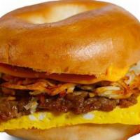1. The Begganator · Toasted Bagel, Egg, Hash browns, Cheddar Cheese, Choice Of Sausage, Ham, Or Bacon.