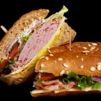 8. The Orlando (Ham) · Sweet Roll, Lettuce, Tomato, Onions, Pickles, Pepperoncini, Mayo & Mustard.