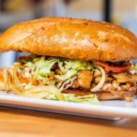 Super Torta · Choice of Meat inside large French Bun, with refried Beans, Cheese, avacado slices, Jalapeno...