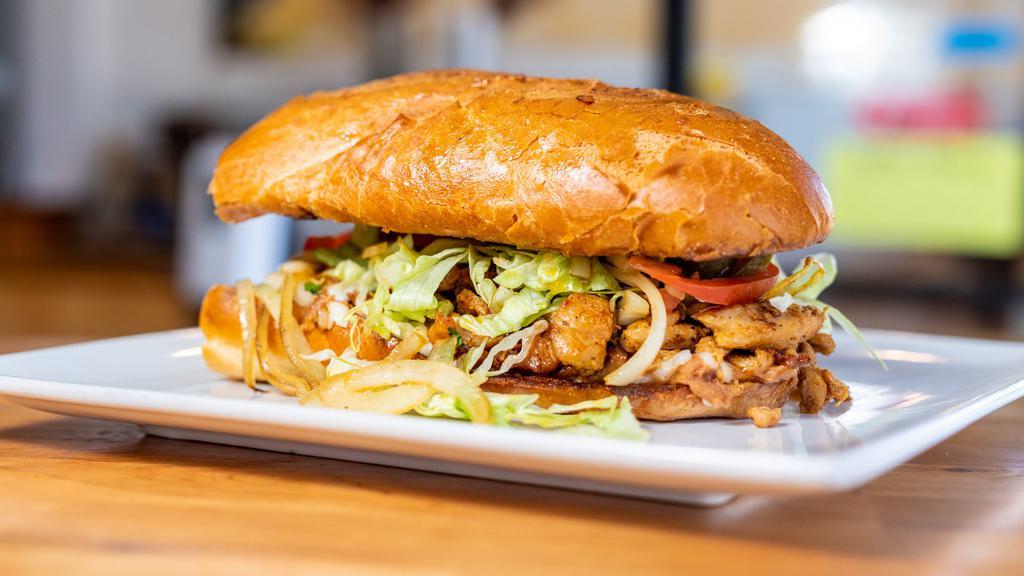 Super Torta · Choice of Meat inside large French Bun, with refried Beans, Cheese, avacado slices, Jalapeno,Tomato and Lettuce