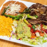 Carne Asada · Grilled Steak Mixed with Onions and Served with Rice, Beans with a side of Guacamole, Pico d...