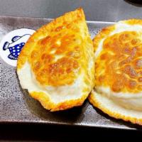 23. Shrimp Egg and Chives Pockets/虾仁韭菜盒子 · 2 pieces.