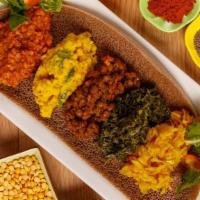 Veggie Combo Breaker · The perfect sampler with red lentils,  yellow lentils, Brown lentils, tikil Gomen(Cabbage) a...