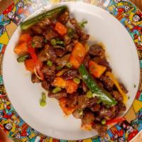 Lamb Tibs · Juicy lamb cooked in a mild stew spiced ,onion, bell pepper, tomato Served with  Injera or Y...