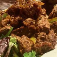 Beef Tibs · Juicy beef marinated in native Ethiopian spices Consequently it is stir with fried onion, to...