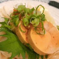 Ankimo · Cooked Monkfish liver with thin slice onion ,chili-tinted grated daikon , scallion and house...
