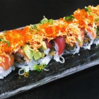 Sunset roll · Shrimp tempura, cucumber wrapped with tuna, salmon & avocado. topped with spicy crab ,flying...