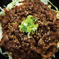 Umakara Beef Bowl · Thin-sliced Yakishabu beef marinated in our sweet & spicy Umakara sauce with sliced onions o...